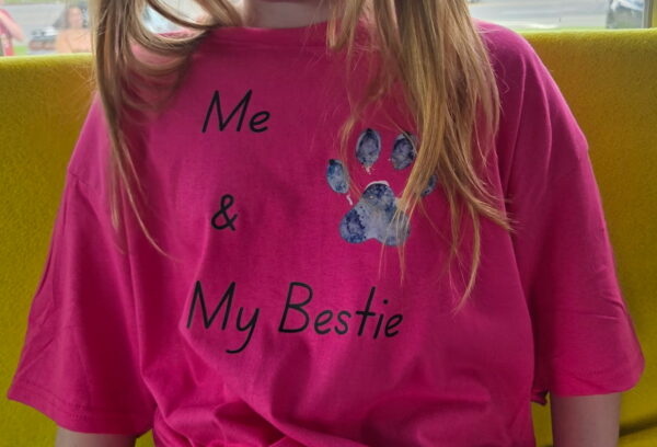Me and My Bestie youth t-shirt with a purple and blue watercolor paw print design.